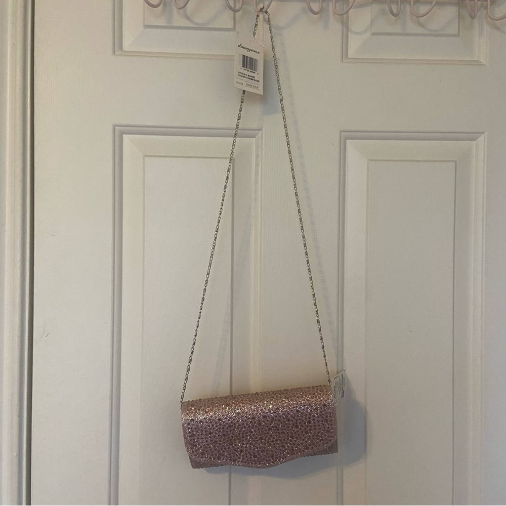Brand new rose gold clutch and cross body